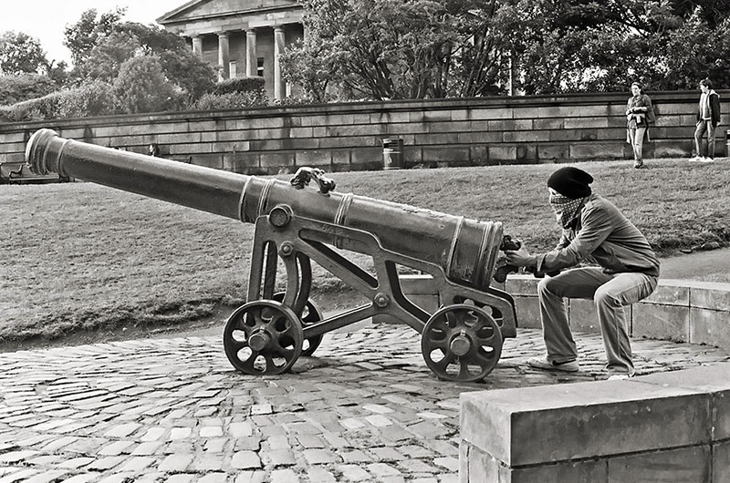 a rebel firing a canon at edinburgh calton hill